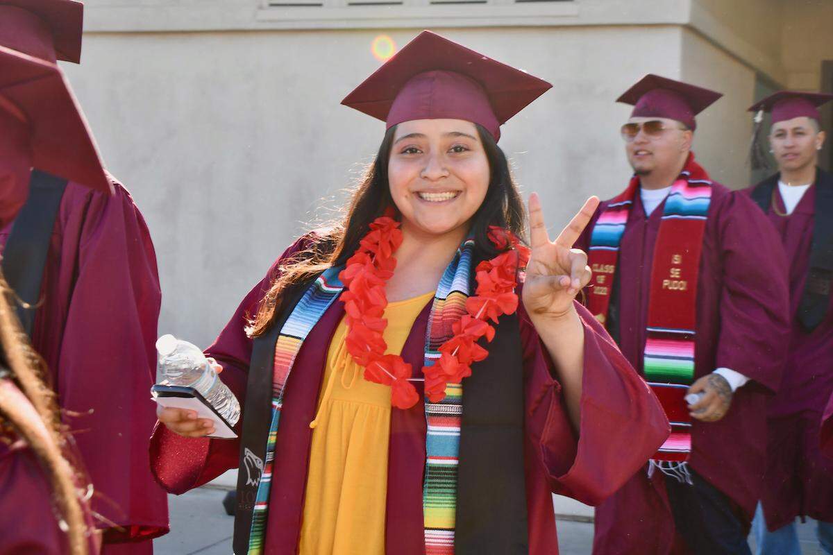 Arisbeth Arteaga poses for a photo during Lopez Continuation High School’s commencement ceremony.