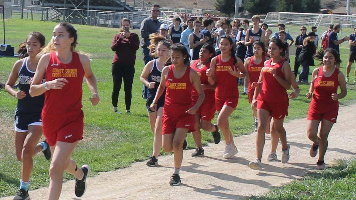 Coast Union High School senior cross country runner Bella Raethke strides out on front of runners from Mission Prep on Sept. 26 in a Cambria meet.