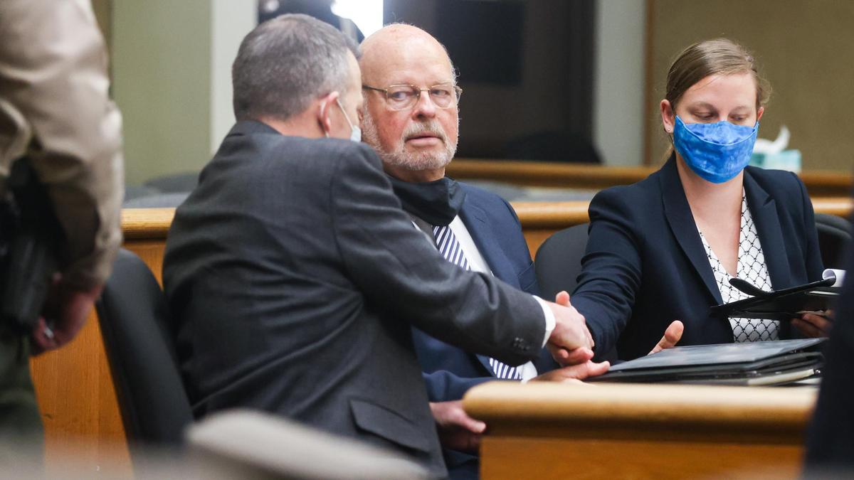 Paul Flores shakes hands with his attorneys at the end of a July 14, 2021, hearing over new charges in the Kristin Smart case. Robert Sanger and his daughter Sarah Sanger are Flores’ co-counsel.