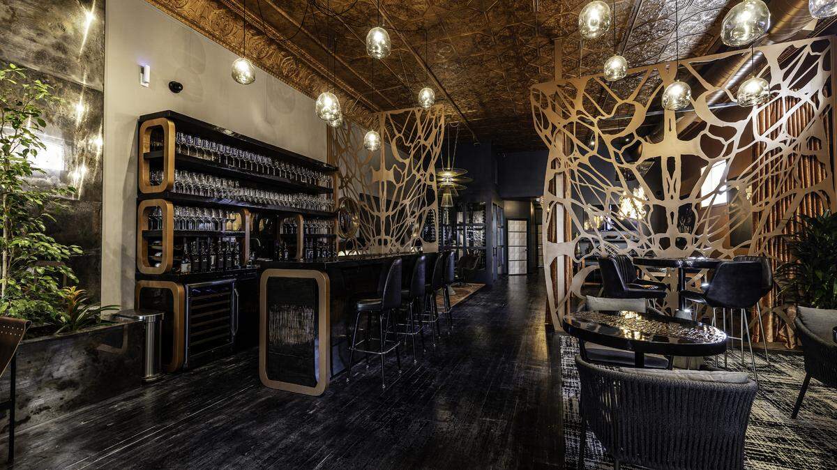 Serial Wines new tasing lounge in Paso Robles features reclaimed materials, industrial finishes and prints of the original artwork found on Serial wine bottles.