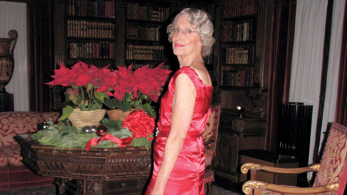 Marjorie Sewell is dressed up for a volunteer shift as a Living History docent on a holiday tour night at Hearst Castle.