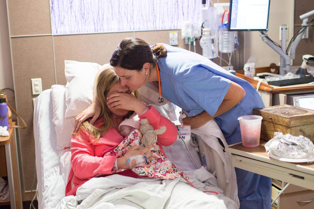 Ashley Agnitch is comforted by a nurse at French Hospital in San Luis Obispo, California after giving birth to her daughter, Greta Agnitch, on April 12, 2017. Greta Agnitch died shortly after her birth due to a genetic condition.