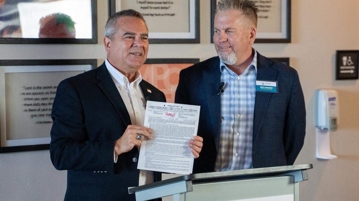 San Luis Obispo Housing Trust Fund CEO Jeff Eckles and Family Care Network CEO Jeff Carlson speak at a news conference on Wednesday, Sept. 10, 2025. The Family Care Network announced it had paid off the first loan ever issued by the Housing Trust around 20 years after receiving the funding.