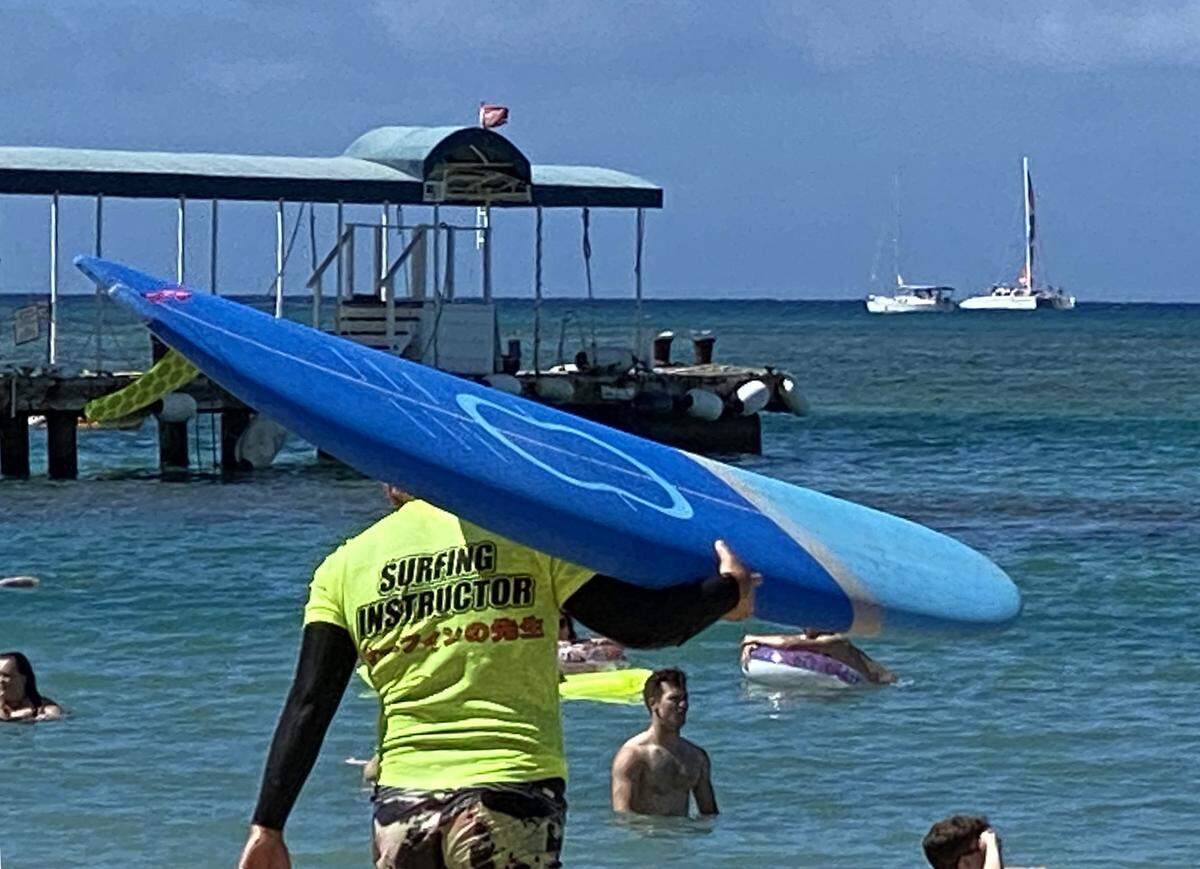 Surfing lessons are popular in Waikiki in Hawaii.
