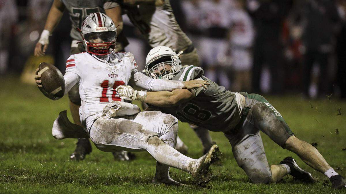 Quarterback Bradley Dockery is brought down by Nick Capaci. Templeton beat North Bakersfield in a football playoff 41-0 on Nov. 21, 2025.