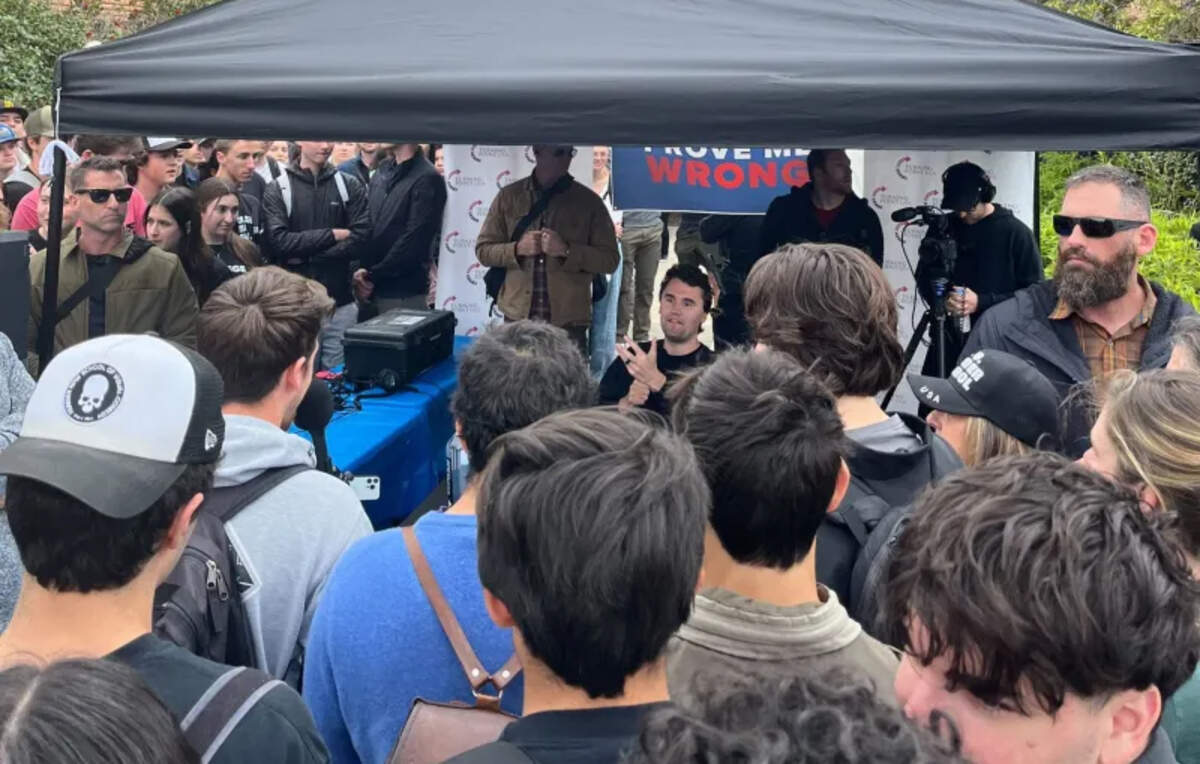 Conservative activist Charlie Kirk speaks to students while hosting a “Prove Me Wrong” table at Cal Poly on March 7, 2024. Kirk was shot and killed while making a similar appearance at Utah Valley University on Sept. 20, 2025.