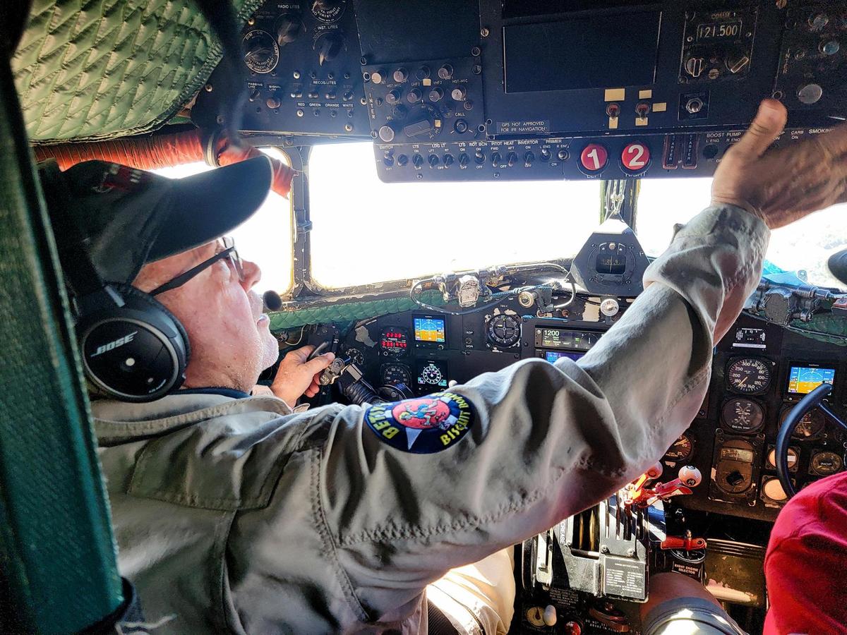 Betsy’s Biscuit Bomber pilot Sherman Smoot checks switches in the cockpit before taking 17 veterans on an Honor Flight from Paso Robles to the coast on Saturday, Aug. 28, 2022.