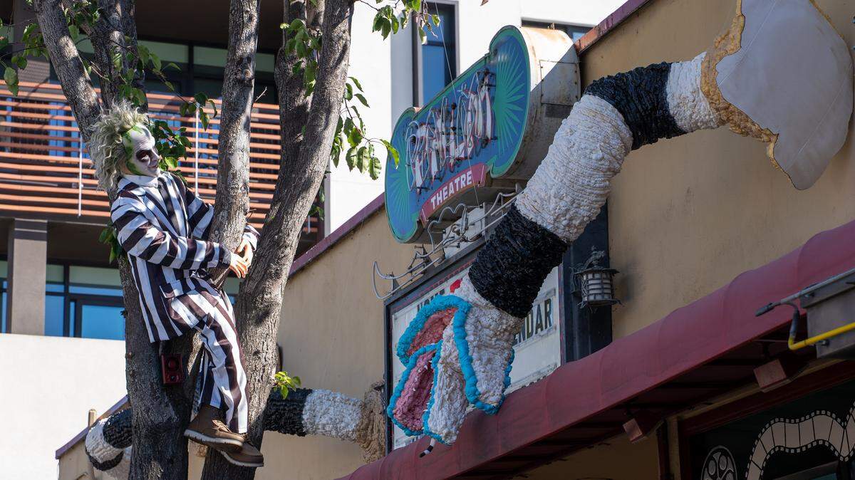 Beetlejuice and a sandworm haunt the outside of the Palm Theatre in downtown San Luis Obispo on Thursday, Oct. 23, 2025. Several stores in the downtown area put up spooky decorations for Halloween.