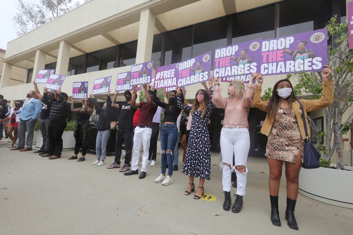 Activists hold signs at the #FREETIANNA rally Tuesday, Aug. 25, 2020, at the San Luis Obispo Courthouse, calling for the criminal case against Tianna Arata to be dropped.