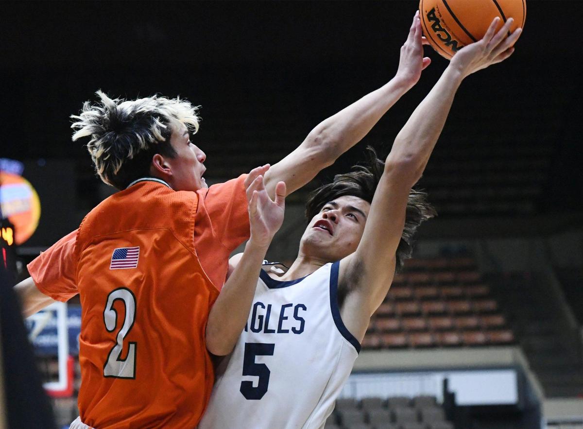 Arroyo Grande’s Zach Soriano, right, runs up against Porterville’s Cooper Fish, left, at the CIF Central Section basketball championships Friday, Feb. 24, 2023, in Fresno. Arroyo Grande won 59-30.