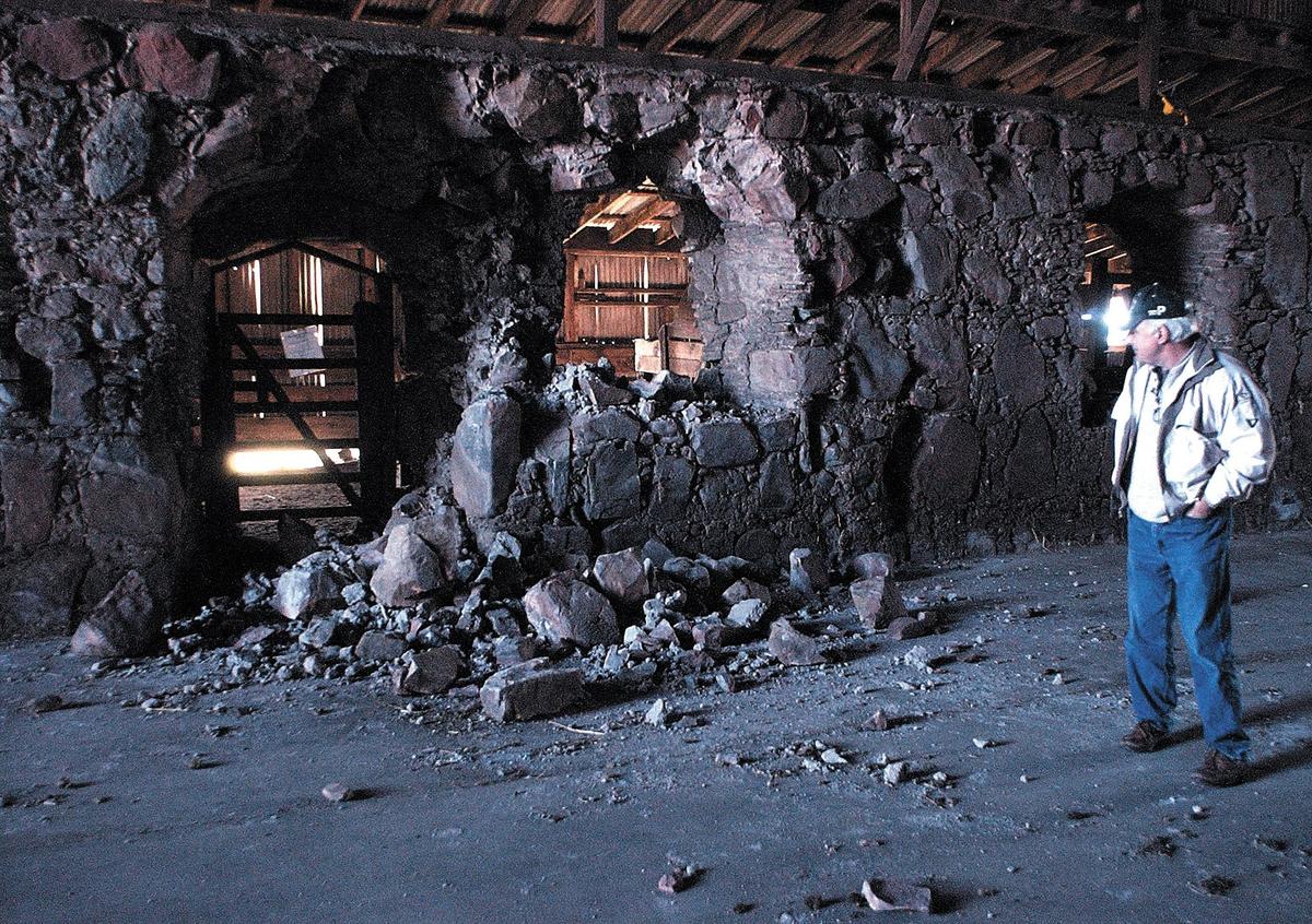The Asistencia was once a chapel and granary serving Mission San Luis Obispo from the other side of the Cuesta Grade at Santa Margarita Ranch. The stone work suffered damage in the San Simeon Earthquake. Rob Rossi looks over one of the archways that had a rockfall, on Jan. 29, 2004.