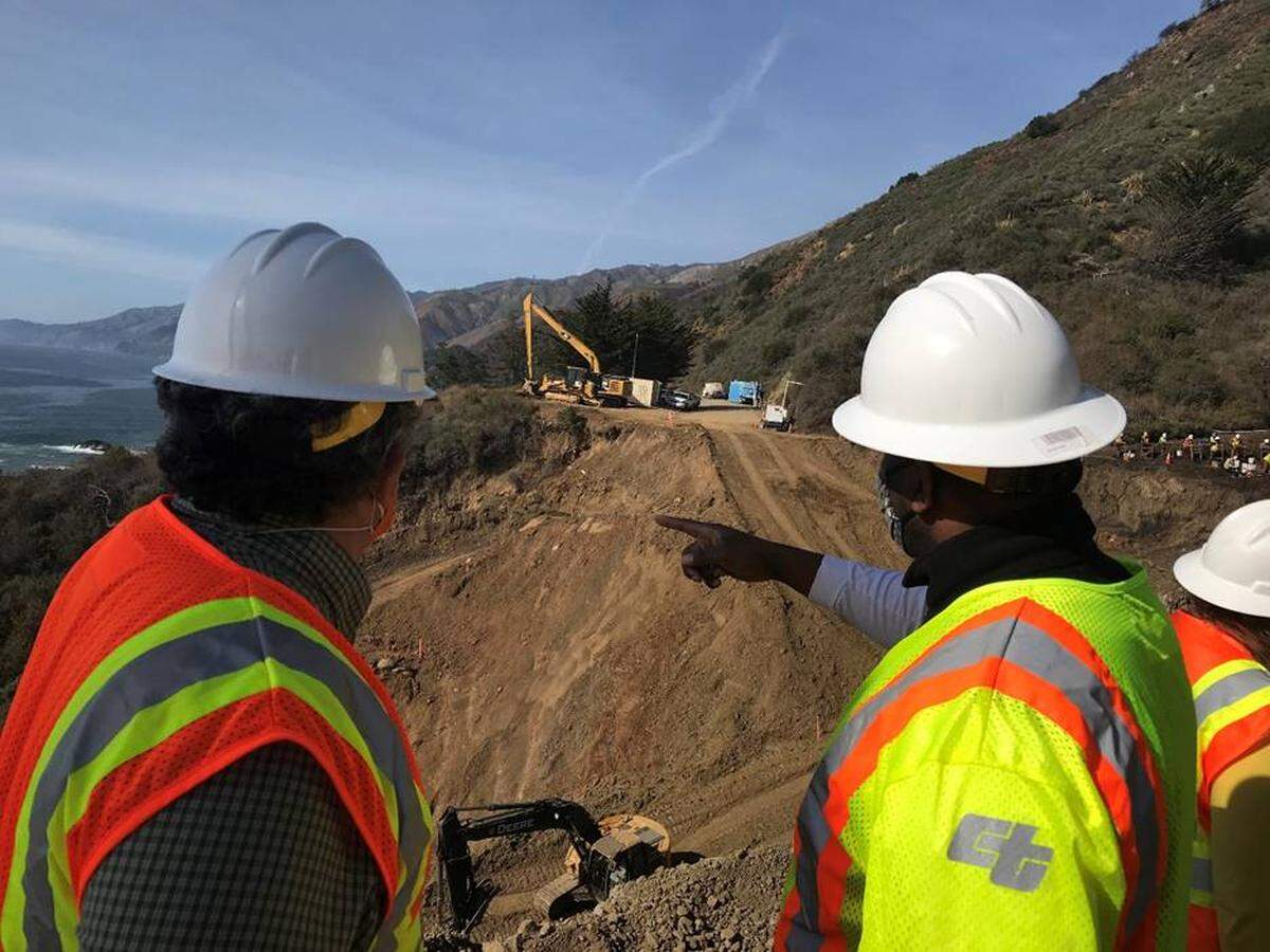 Caltrans Director Toks Omishakin, right, reviews the Rat Creek closure of Highway 1 near Big Sur from the south with District 5 director Tim Gubbins on March 5, 2021.