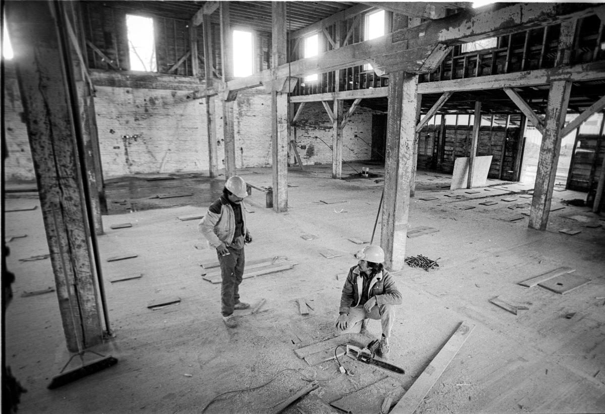 Salvador Nungaray and Adlid Cornejo of Paso Robles stand among 12 x 12 inch redwood beams that made up the 5 story Granary building. The building in Paso Robles was getting ready for a new life after being built as a flour mill in 1891 and was later a granary, shipping wheat and barley. The building was being cleared for renovation Jan. 6, 1887.