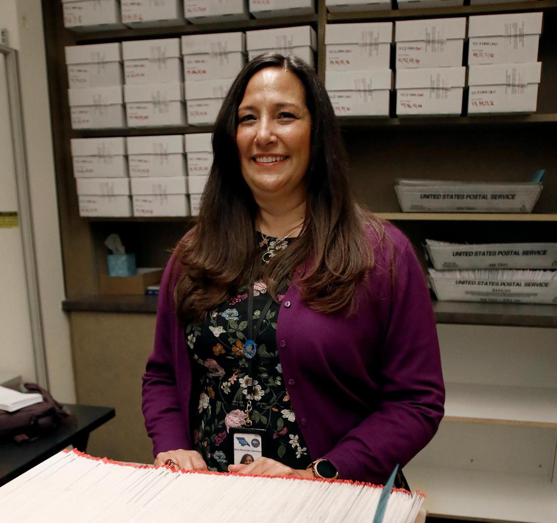 SLO County Clerk-Recorder Elaina Cano watches over the processing of vote-by-mail ballots on Nov. 9, 2022.