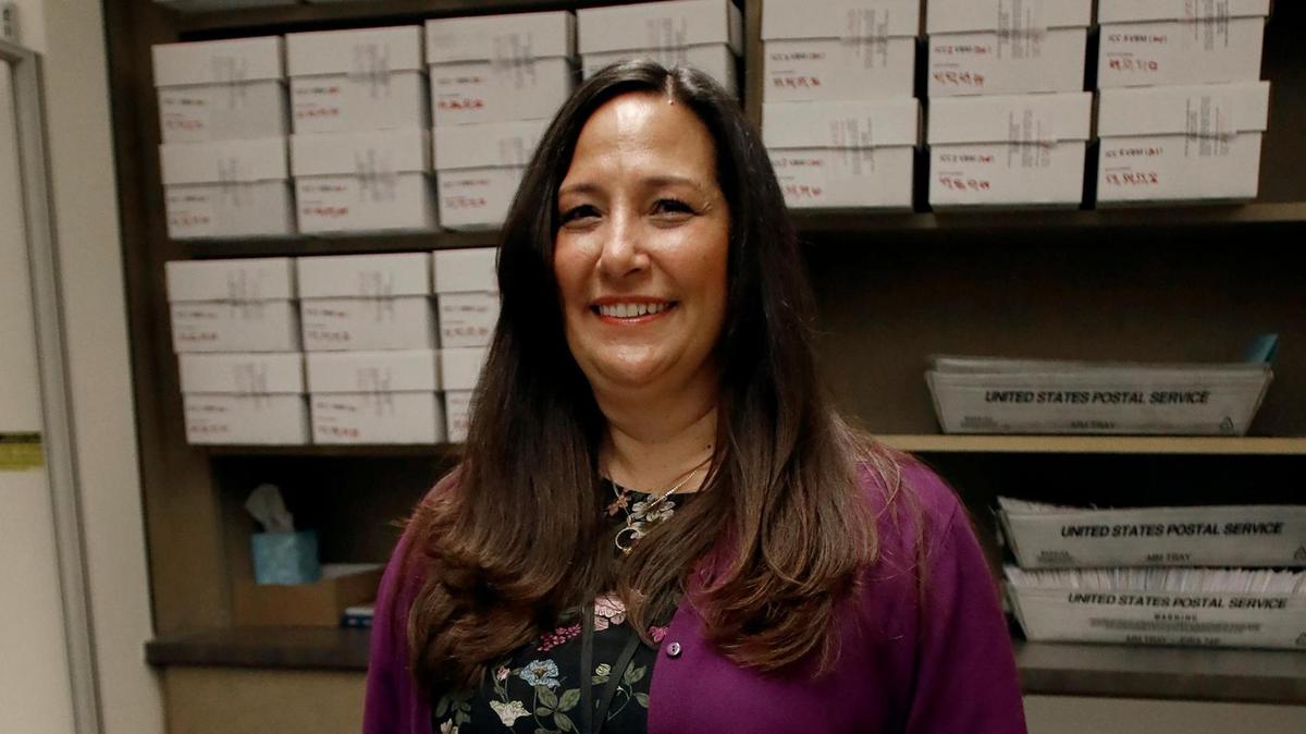 SLO County Clerk-Recorder Elaina Cano watches over the processing of vote-by-mail ballots on Nov. 9, 2022.