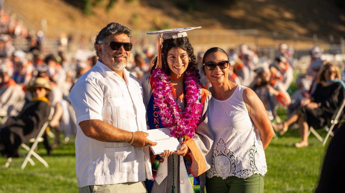 Atascadero High School graduate Scarlette Fonseca receives her diploma with her parents at commencement ceremonies on Wednesday, June 3, 2026. 296 seniors walked the stage and received their diplomas.