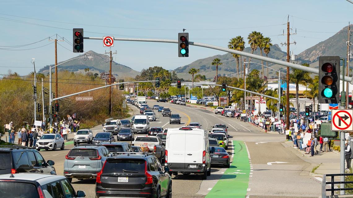 Around 500 people turned out at Los Osos Valley Road near Highway 101 to protest the second term of Donald Trump and right-wing policies Monday, Feb. 17, 2025.