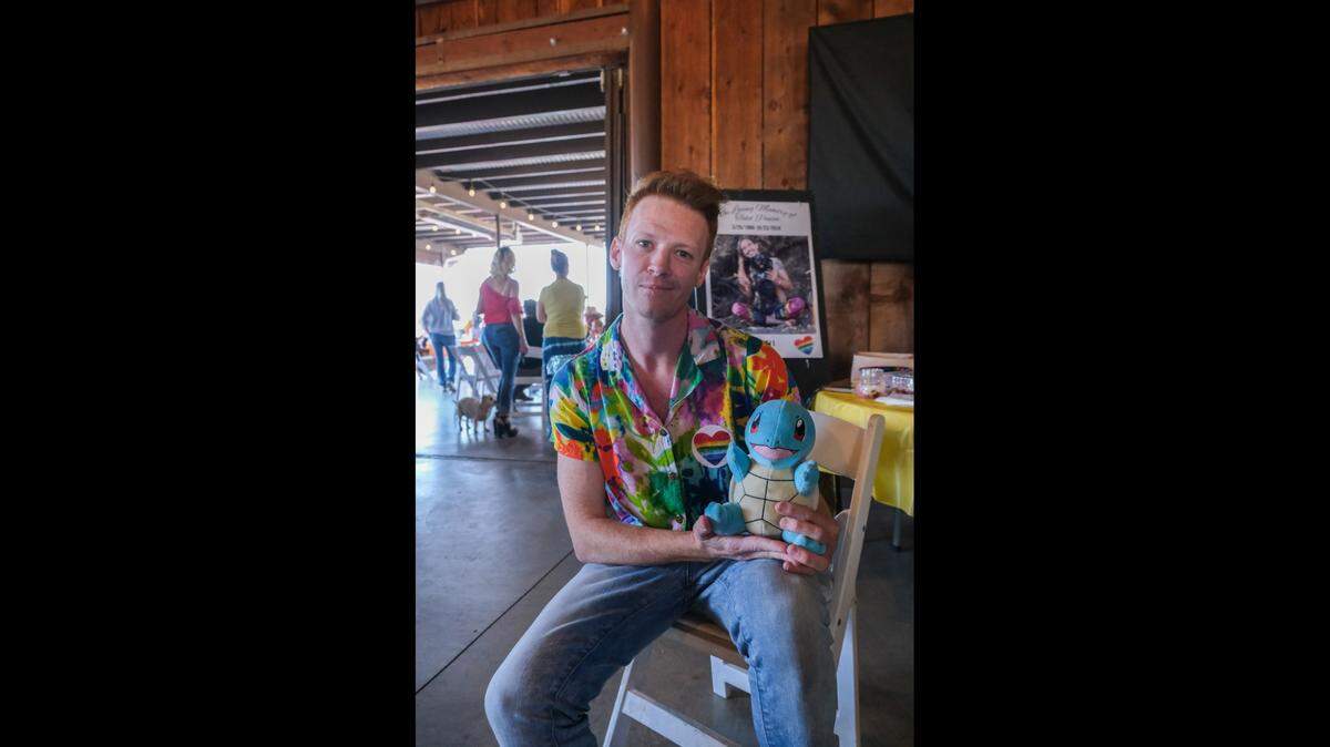 Jakey Harper hold a Squirtle stuffed animal given to him by Todd Pinion, at Pinion’s memorial in Santa Margarita on Nov. 9, 2024. Pinion was killed in an alleged hate crime on Oct. 23, 2024.