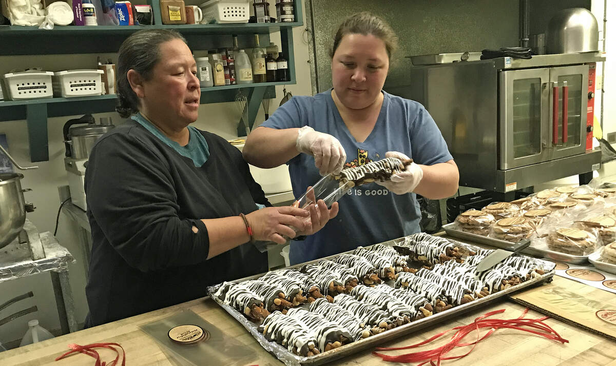 Monica and Tyler Nichol bag up their Naughty Rod sweet-savory pretzels in 2022, soon after they bought the Red Moose Cookie Company in Cambria. The shop is Cambria’s 2026 Business of the Year, according to the town’s Chamber of Commerce.