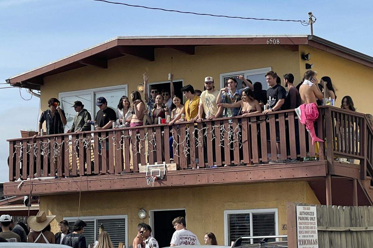 Revelers attend a party during Deltopia in Isla Vista. 