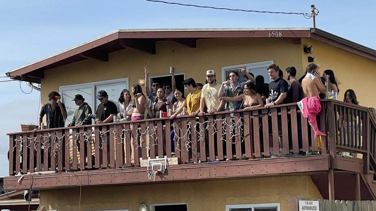 Overcrowded balconies are among the hazards at the annual Deltopia celebration in Isla Vista. Here, partiers overload a balcony in 2022.