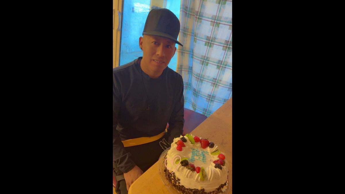 Ismael Garcia Cruz smiles with a cake on his 30th birthday. Garcia Cruz was taken by Immigration and Customs Enforcement on July 2, 2025, after he attended a court hearing.