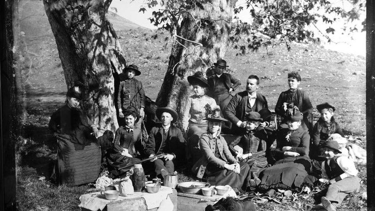 Church picnic including a man with a shotgun. The Paso Robles Historical Society is undertaking the task of recovering 2,000 glass plate negatives in the county made circa 1886-1888 by Richard J. Arnold.
