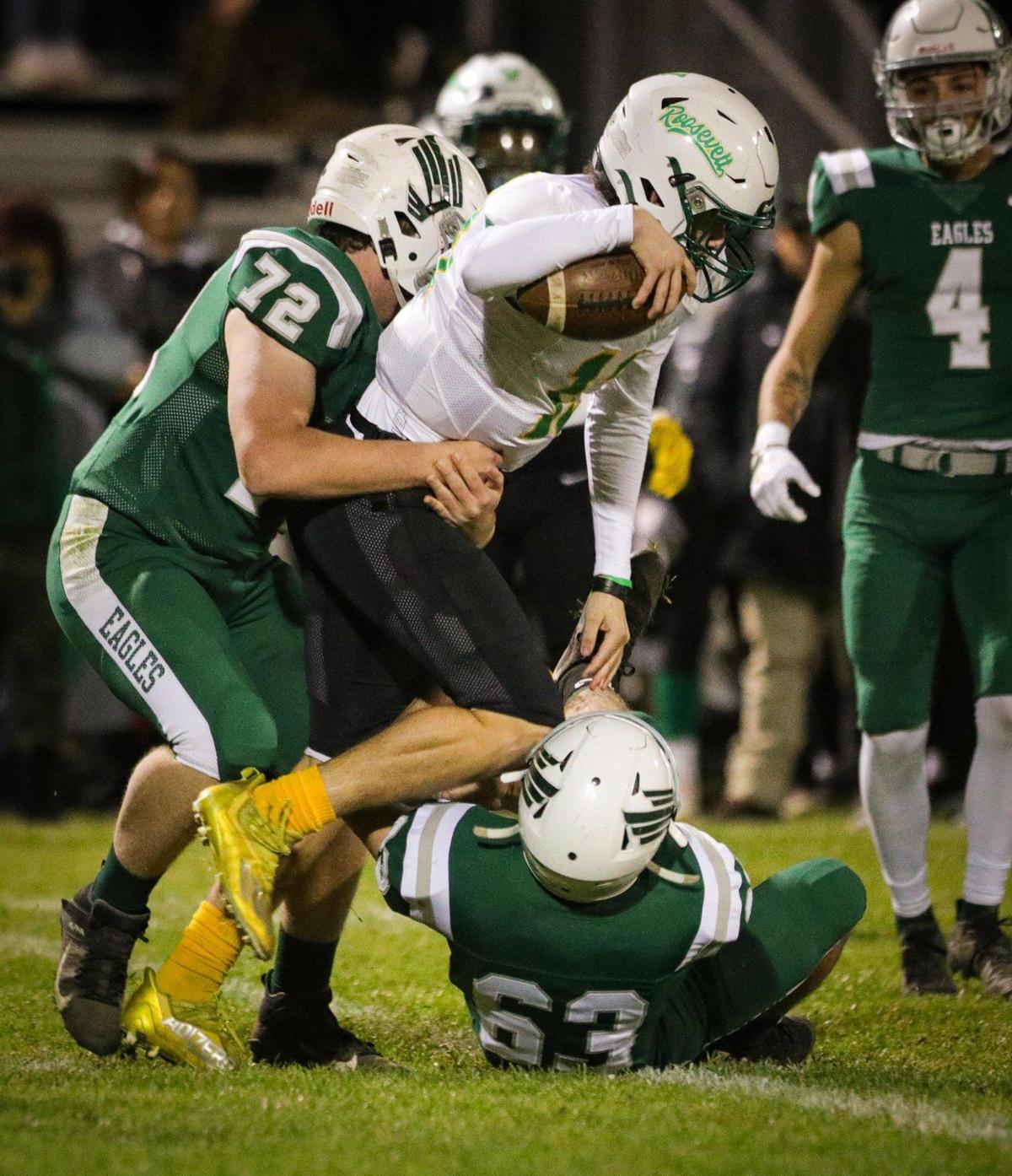 Aiden Wall (72) and Lane Miller (63) tackle Jackson Kloster. Templeton beat Roosevelt 27-14 on Nov. 4, 2022, in a first-round playoff football game.