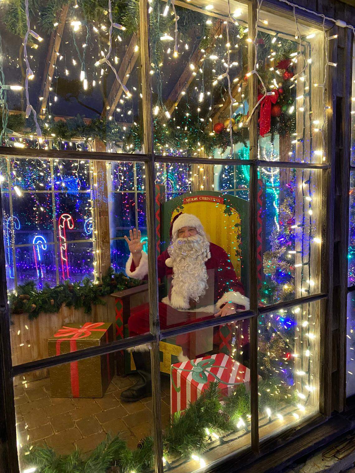 Santa Claus greets visitors to the Cambria Christmas Market in 2019. The popular San Luis Obispo County holiday event will reopen to the public in November 2022.