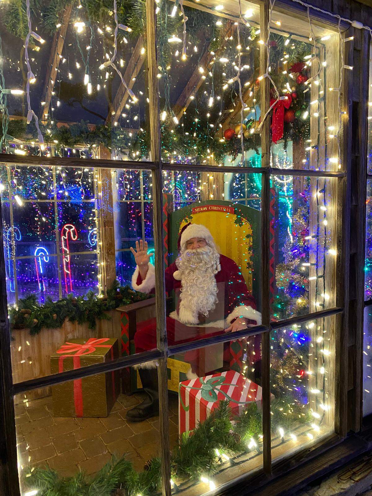 Joe Santalla has ‘been Santa’ off and on for decades. His latest assignment is being one of Santa’s stand-ins at the Cambria Christmas Market. Here, he’s shown on Dec. 10 during a momentary lull in the crush of youngsters eager to share their thoughts, hopes and wishes with Santa Claus.