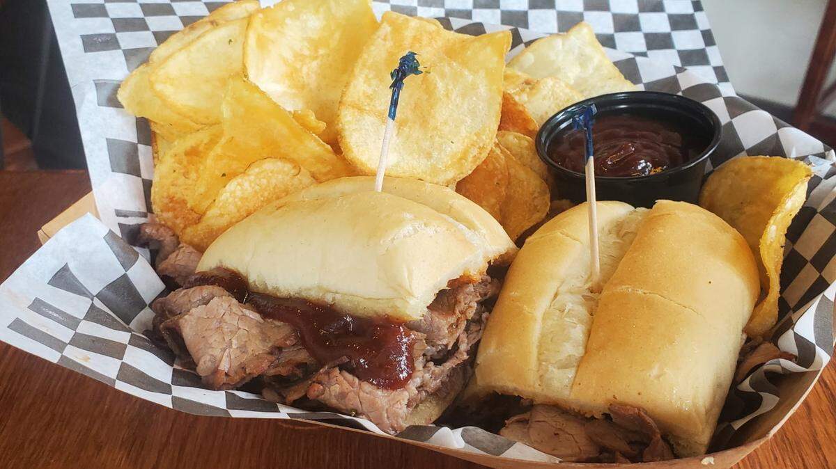 The smoked  tri-tip sandwich as Savory Smoke is cooked low and slow in a smoke box and then thinly sliced deli-style onto sandwich buns.