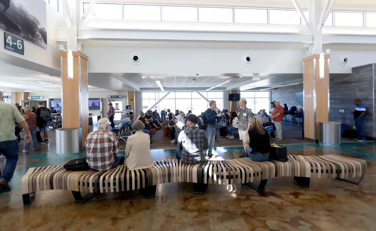 Travelers wait for the first flight from the San Luis Obispo County Regional Airport to Las Vegas on Thursday.