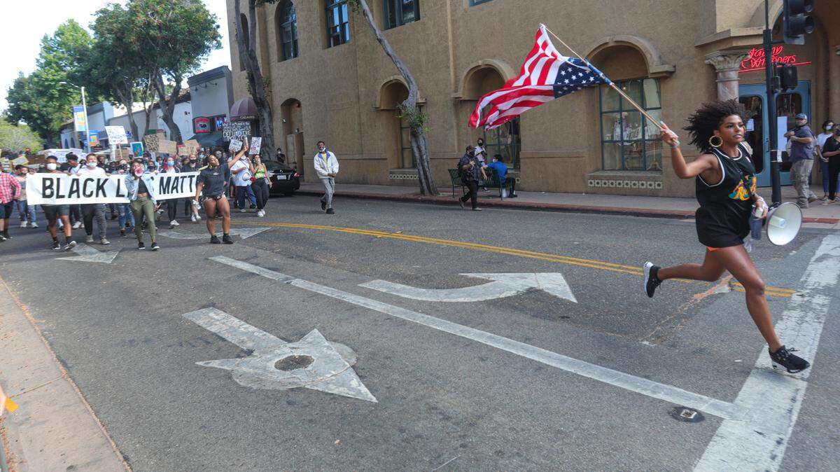 Tianna Arata leads marchers down Chorro Street during the protest on July 21, 2020. The demonstration ended with her arrest as she was packing up at Mitchell Park.