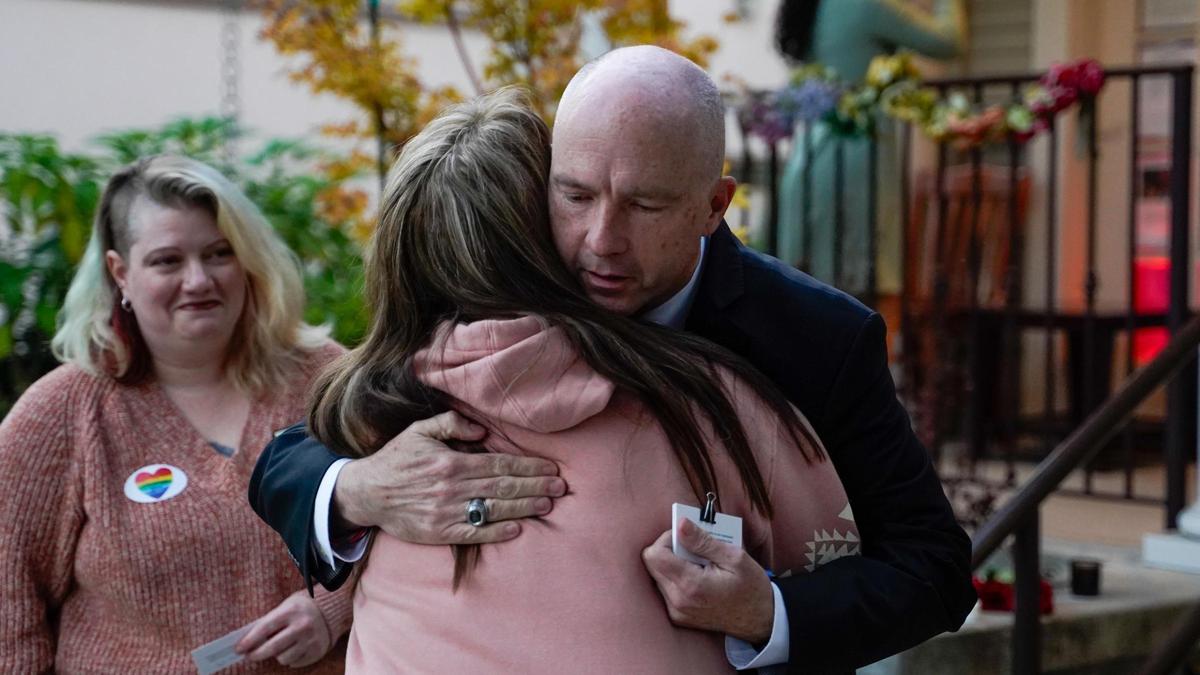 Melody Pinion hugs San Luis Obispo County District Attorney Dan Dow at a vigil hosted by the Gala Pride & Diversity Center Friday in memory of her son Todd Joseph Pinion, an Atascadero resident who was killed in an alleged hate crime, Nov. 22, 2024.