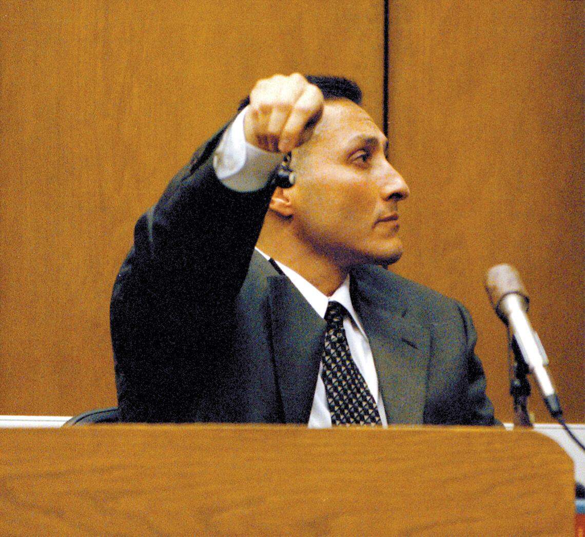 At Rex Krebs’ murder trial on March 21, 2001, David Zaragoza shows the jury the 8-ball keychain that belonged to murder victim Aundria Crawford. Zaragoza found it while searching Rex Krebs’ home, he testified in court in Monterey, where the trial was held after a change of venue.