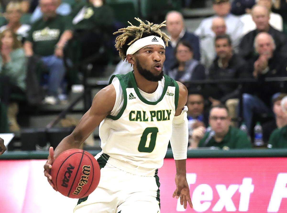 Cal Poly’s Keith Smith (0) looks for an opening during Cal Poly’s 63-45 to UC Santa Barbara on Jan. 8, 2020, at Mott Athletics Center. He scored 10 points in Tuesday’s win against Fullerton.