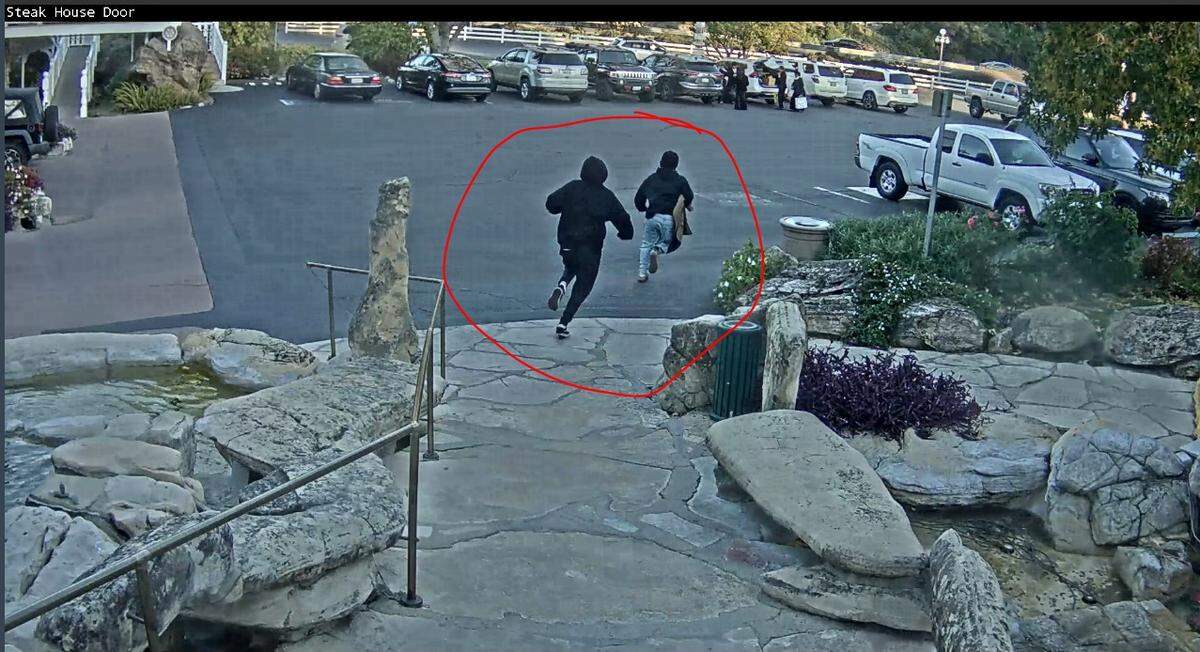 Two young men in black hoodies and medical masks were seen stealing the welcome rug from the Madonna Inn steakhouse on the afternoon Nov. 16, 2024. This is the fifth time the rug has been stolen in four years.
