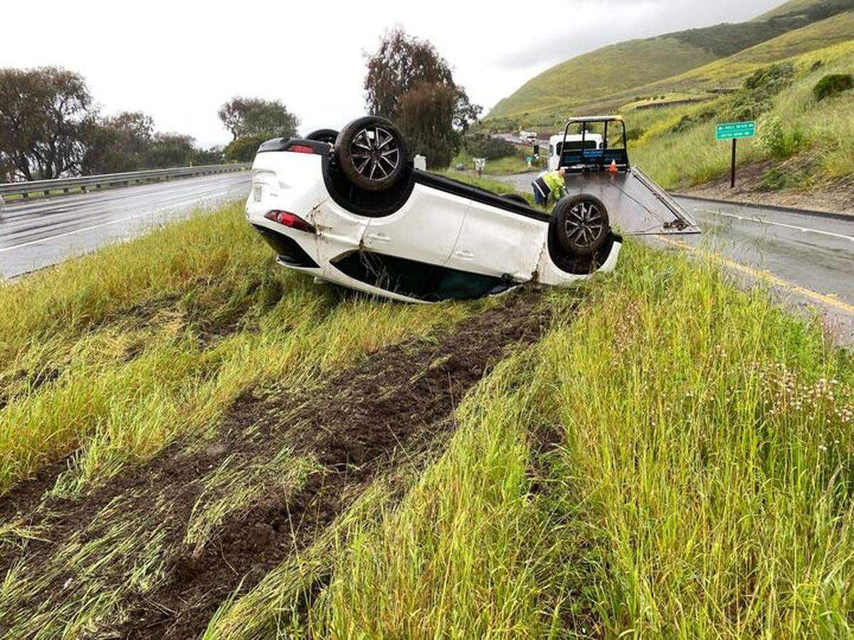 A vehicle overturned on the roadside of the Highway 101 offramp near Mattie Road in Pismo Beach on March 10, 2023. 