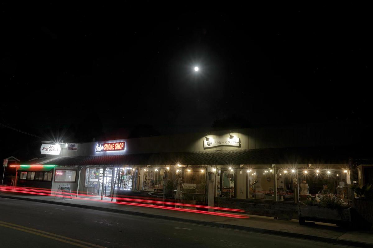 A pizza restaurant, smoke shop and a vintage shop on Main Street in Cambria. The Dark Skies Initiative committee wants to certify Cambria as an official dark-sky community. Cambria has been working for nine years to preserve and enhance those views from the small coastal town.