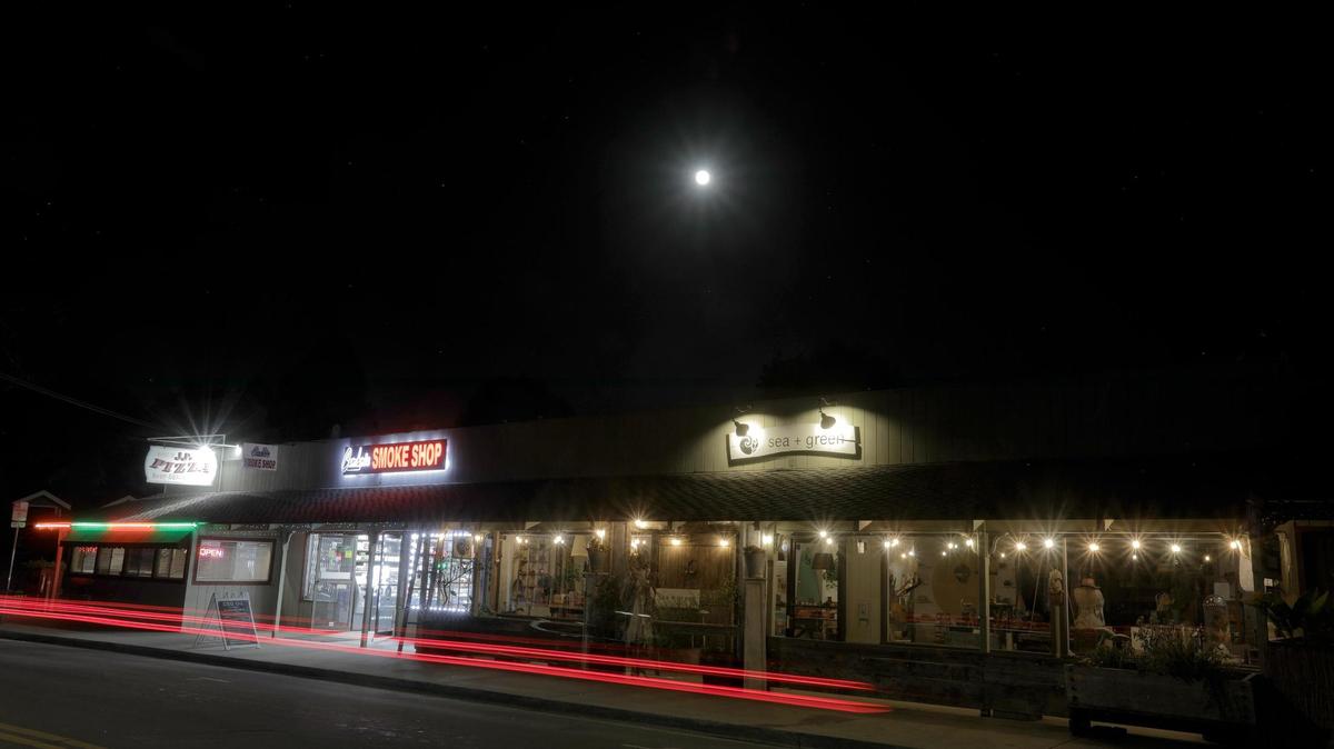 A pizza restaurant, smoke shop and a vintage shop on Main Street in Cambria. The Dark Skies Initiative committee wants to certify Cambria as an official dark-sky community. Cambria has been working for nine years to preserve and enhance those views from the small coastal town.