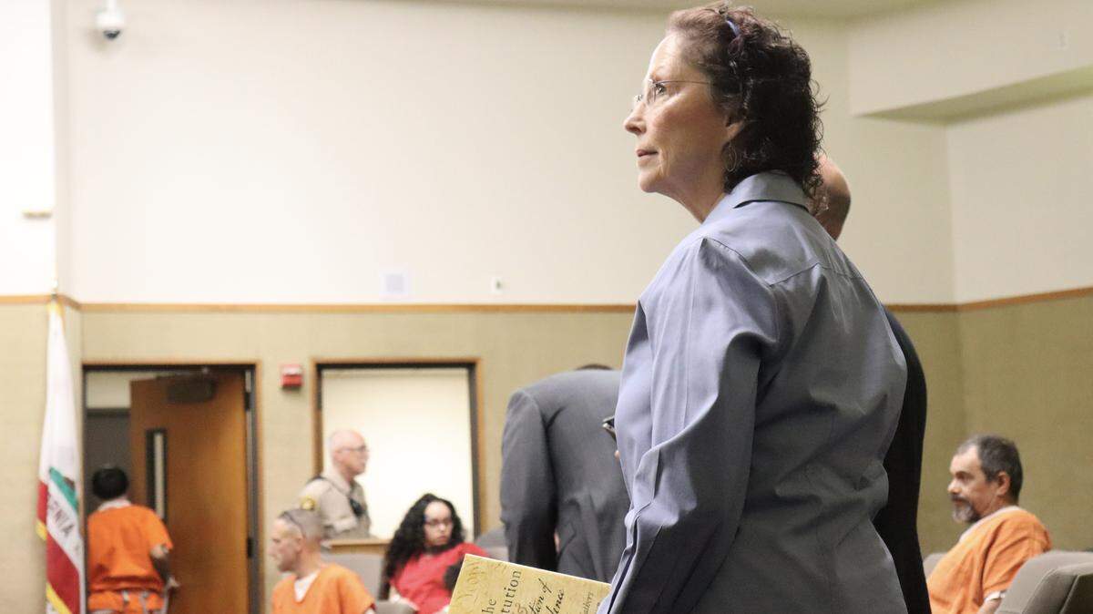 Former two-time Arroyo Grande mayoral candidate Gaea Powell, who has been charged with nine counts of election and voter fraud — including eight felonies — relating to both campaigns, held a copy of the Constitution as she requested to invoke her constitutional right to represent herself in court on Sept. 15, 2025.
