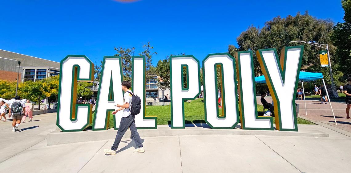 Students walk past the Cal Poly sign in the University Union on Sept. 24, 2024.
