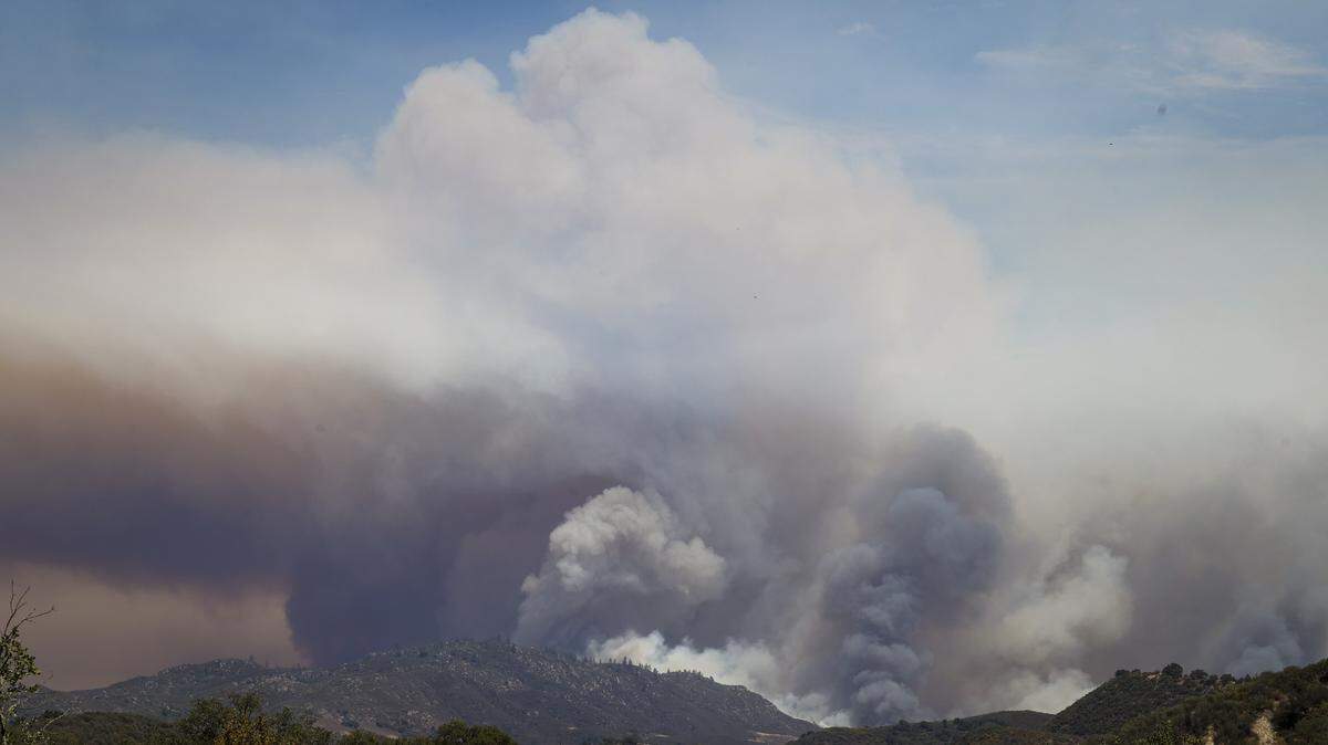Smoke rises from the Gifford Fire burning from the Los Padres National Forest toward an area under an evacuation order behind Lopez Lake, seen here from Hi Mountain Road on Aug. 7, 2025.