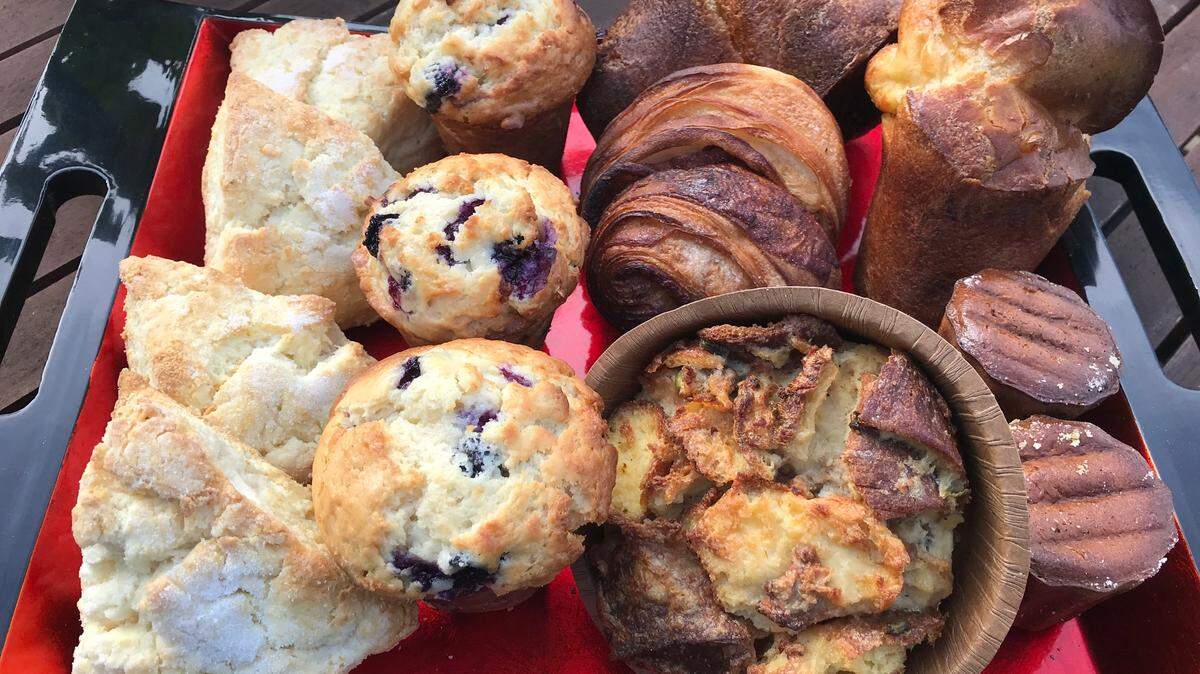Customers will find these and other classic French treats at Bijou Bakery on the grounds of the historic Cass House in Cayucos. Clockwise from left are lemon scones, blueberry muffins, huge popovers, canelé (weekends only) and Pain Bijou (a special bread pudding creation). A cinnamon morning bun, an upscale French nod to a cinnamon roll, is in the middle. These scones and canelé are gluten-free, but the scones are also available regularly in a wheat-based version.