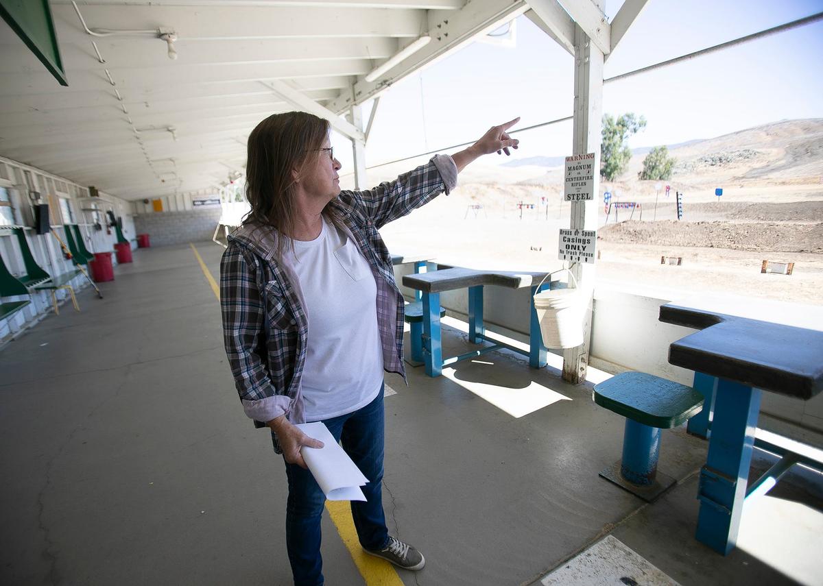 Julia Soto is the general manager of SLO Sportsmen’s Association pistol range located on Highway 1 in rural San Luis Obispo. Soto is pointing out the target area of the shooting range.