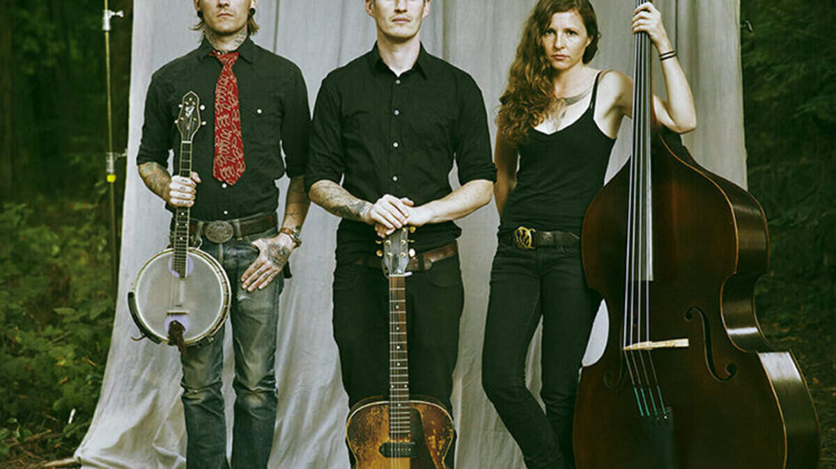 The Devil Makes Three -- from left, Cooper McBean, Pete Bernhard and Lucia Turino -- perform at the Alex Madonna Expo Center in San Luis Obispo.