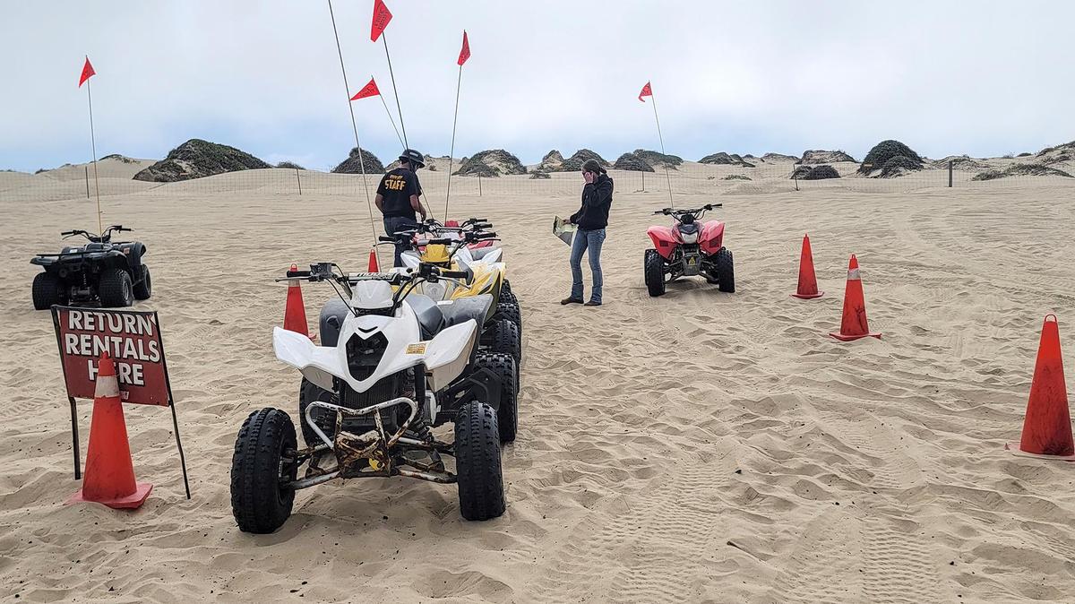 Vehicles are lined up at an off-loading area for Steve’s ATV Rentals at Post 2 at Oceano Dunes State Vehicular Recreation Area on Friday, July 21, 2023.