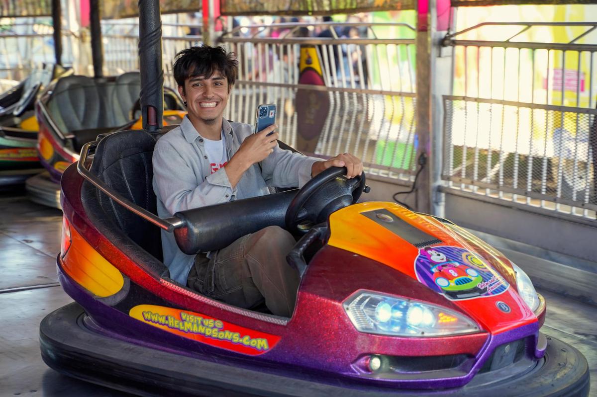 Tribune reporter Angel Corzo rides the bumper cars at the California Mid-State Fair on Wednesday, July 16, 2025. The Mid-State Fair will run from July 16-27.