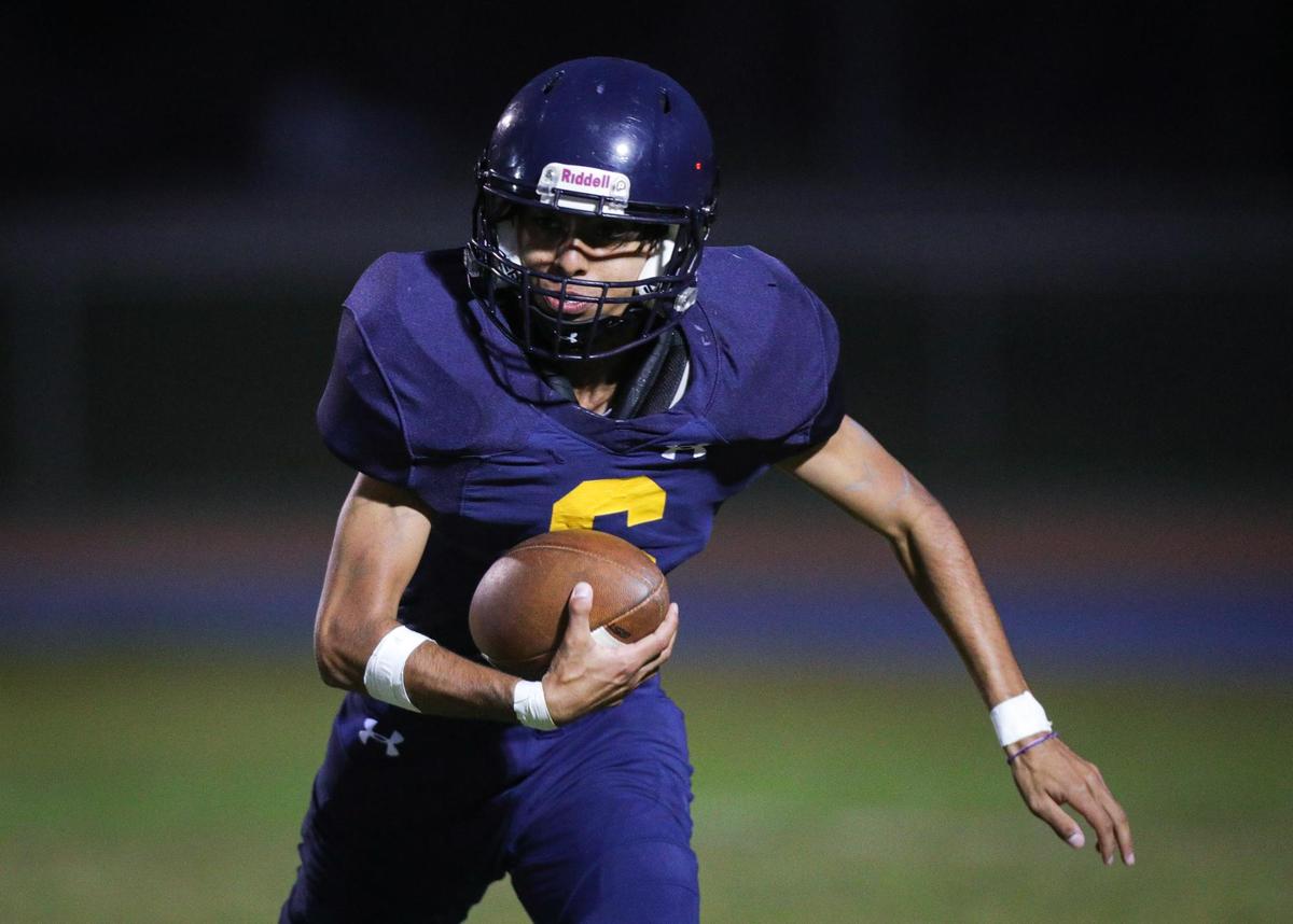 Josue Lopez Ramirez turned a bad punt snap into a first down, but Arroyo Grande fell 39-7 to Centennial of Bakersfield on Aug. 26, 2022.
