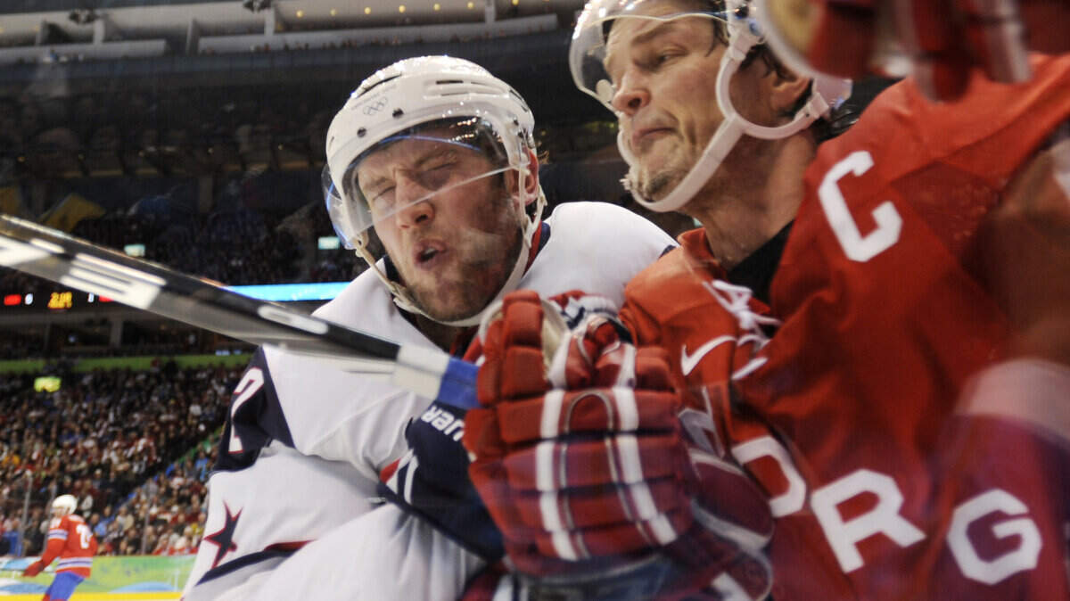 The United States' David Backes (left) grimaces as he checks Norway's Tommy Jakobsen. (Clem Murray / Philadelphia Inquirer / MCT)